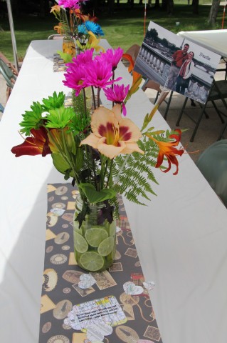 Example of the beautiful flower arrangements--they had lemons and limes in the vases for some summer color and many of the flowers were picked from my mom's gardens. They featured pictures of the fiance and I from around the world.