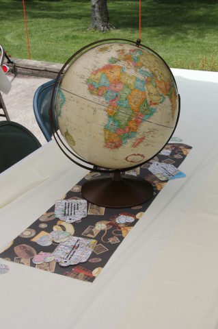 Some old globes also featured as centerpieces. Everything was surrounded by little luggage tags made from maps with travel quotes.