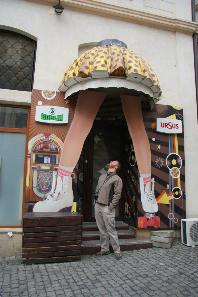 My husband, appreciating the signage at one of the establishments