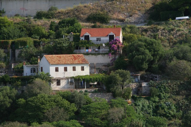 Red roofs lined the shoreline houses