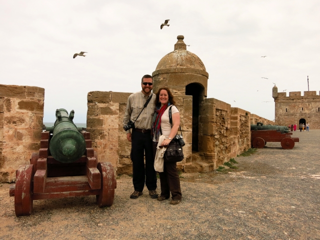 Standing on a paved walkway along the Atlantic Ocean in Essaouira