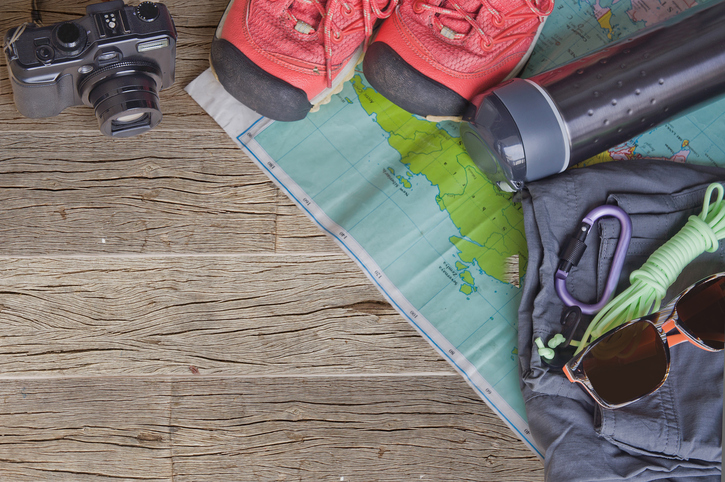 Top view of travel accessories for a mountain trip